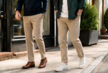 Two men compare formal creased khakis with brogues and cuffed chinos with sneakers.