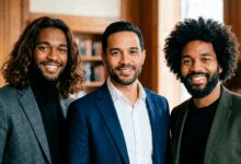 Three men with different curly and coily hair types wearing smart casual outfits indoors