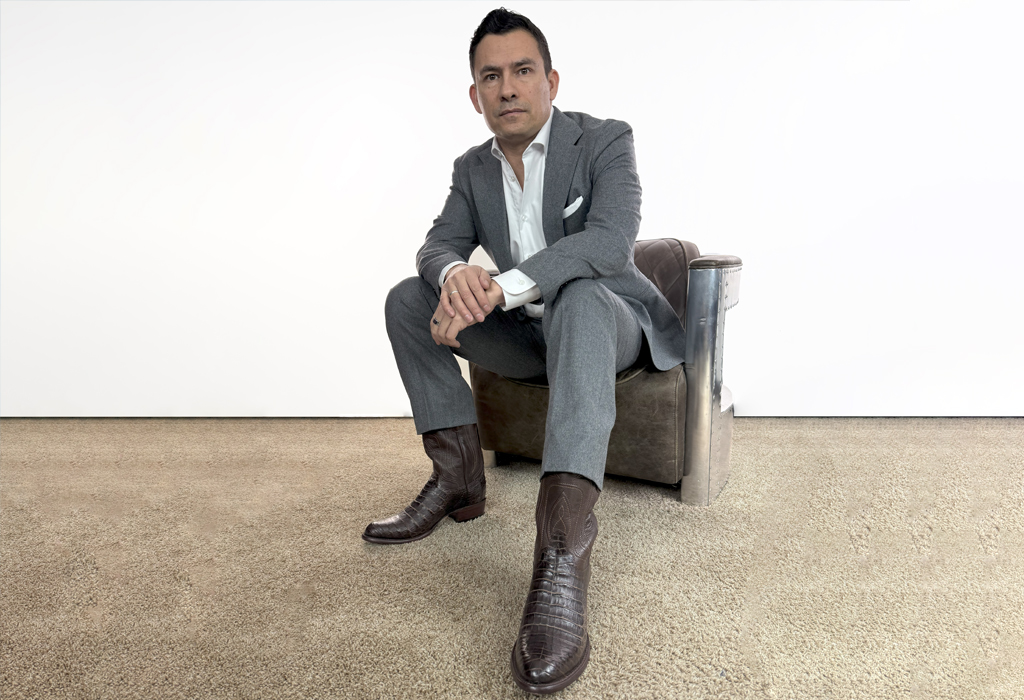 antonio centeno wearing suit and western boots