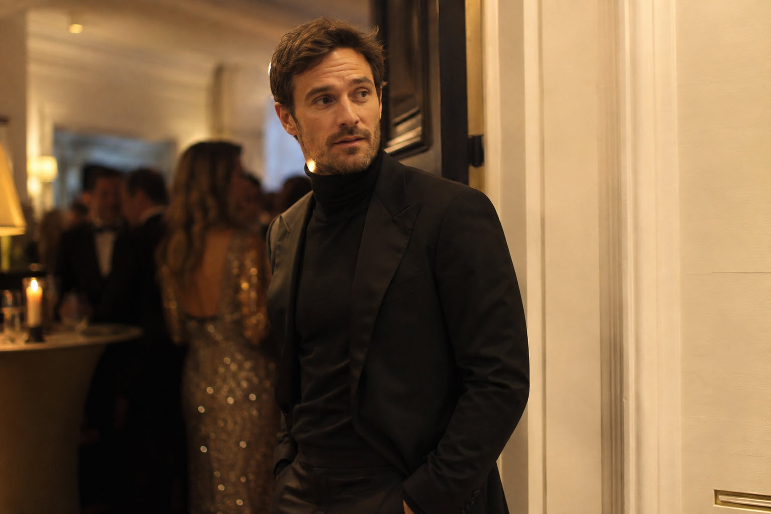 man in a black dinner jacket with a fine black turtleneck instead of a shirt and bow tie
