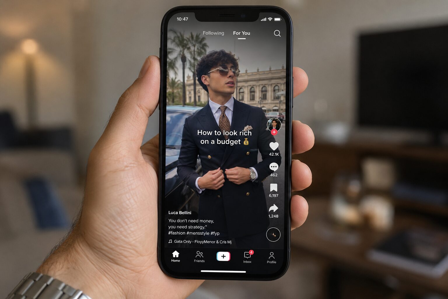Hand holding smartphone showing men’s style TikTok video about looking rich on budget.