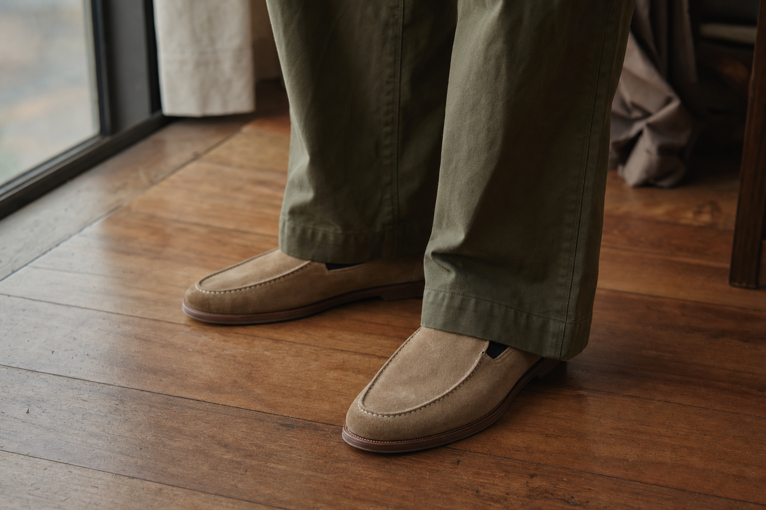 man wearing wide leg trousers and loafers